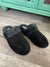Black furry slippers